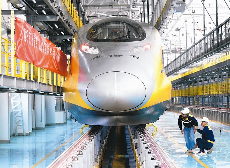 Staff of China Railway Seventh Group Co Ltd check a bullet train at maintenance station. Photo courtesy of China.org.cn