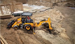 A JCB 3CX is busy digging on a job site. A JCB 3CX is busy digging on a job site.