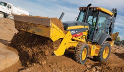 A John Deere 310SL puts in hard hours of moving dirt. A John Deere 310SL puts in hard hours of moving dirt.