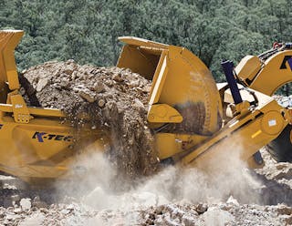 A K-Tec 1243 moves dirt on an airport project.