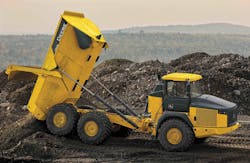 A John Deere 460E unloads on the job site. A John Deere 460E unloads on the job site.