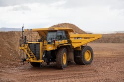 A Komatsu HD785 carries a full load. A Komatsu HD785 carries a full load.