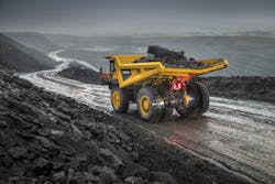 A Volvo R100E navigates its way through muddy, sloped terrain. A Volvo R100E navigates its way through muddy, sloped terrain.