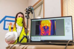 A thermal camera registers an employee’s temperature before she begins her shift. Photo courtesy of Suffolk Construction. A thermal camera registers an employee’s temperature before she begins her shift. Photo courtesy of Suffolk Construction.