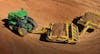A John Deere scraper system featuring a 9570RT track tractor and 2112D scraper