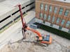A Doosan DX350LC-5 with mast installs columns in tight spaces.