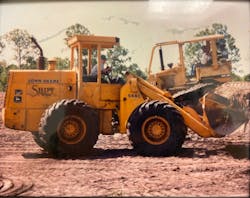 Jon Shipps in an old front loader with his father and brother in the dozer