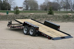 Towmaster’s hydraulic bifold ramp extends the full width of the trailer. Towmaster’s hydraulic bifold ramp extends the full width of the trailer.