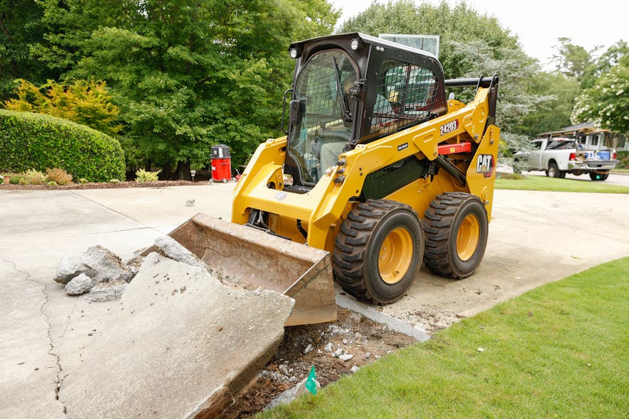 CAT&rsquo;s 262D3 gets past the concrete to find the dirt.