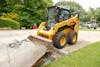 CAT&rsquo;s 262D3 gets past the concrete to find the dirt.